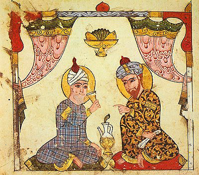 Two seated men, sharing a drink